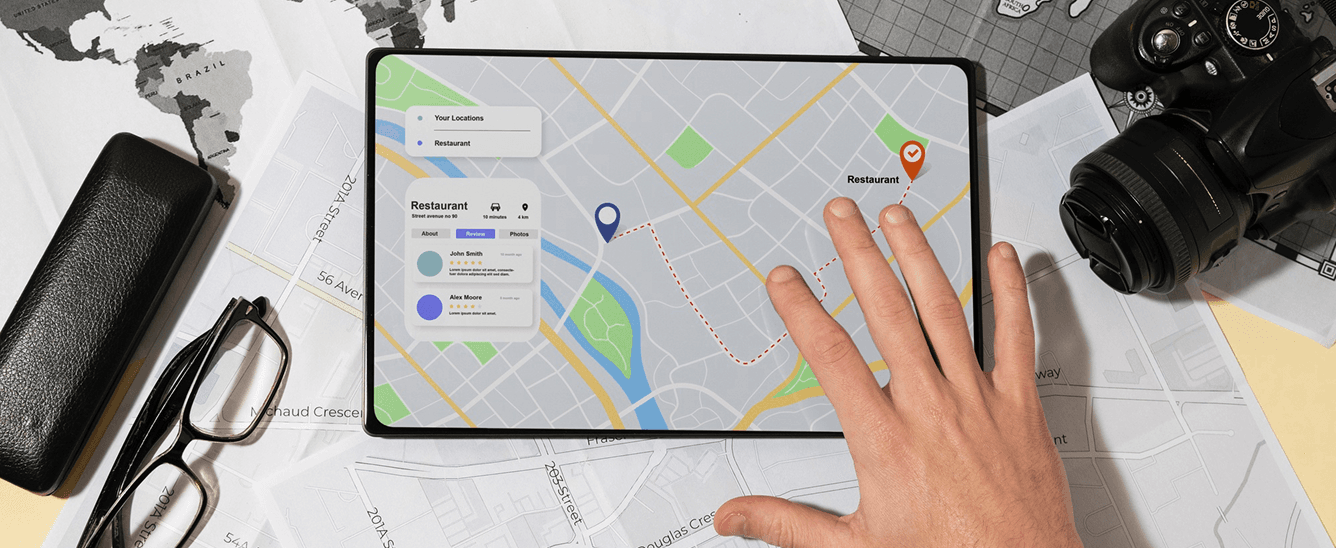 A hand on a tablet showing a field team's route on a map